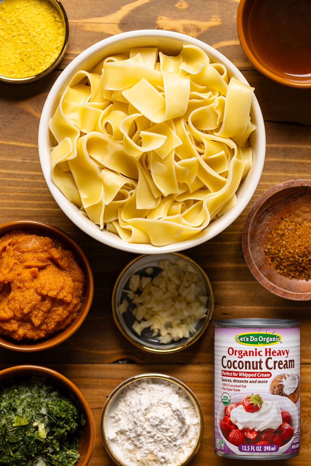 Ingredients including pappardelle pasta, pumpkin puree, coconut cream, etc. 