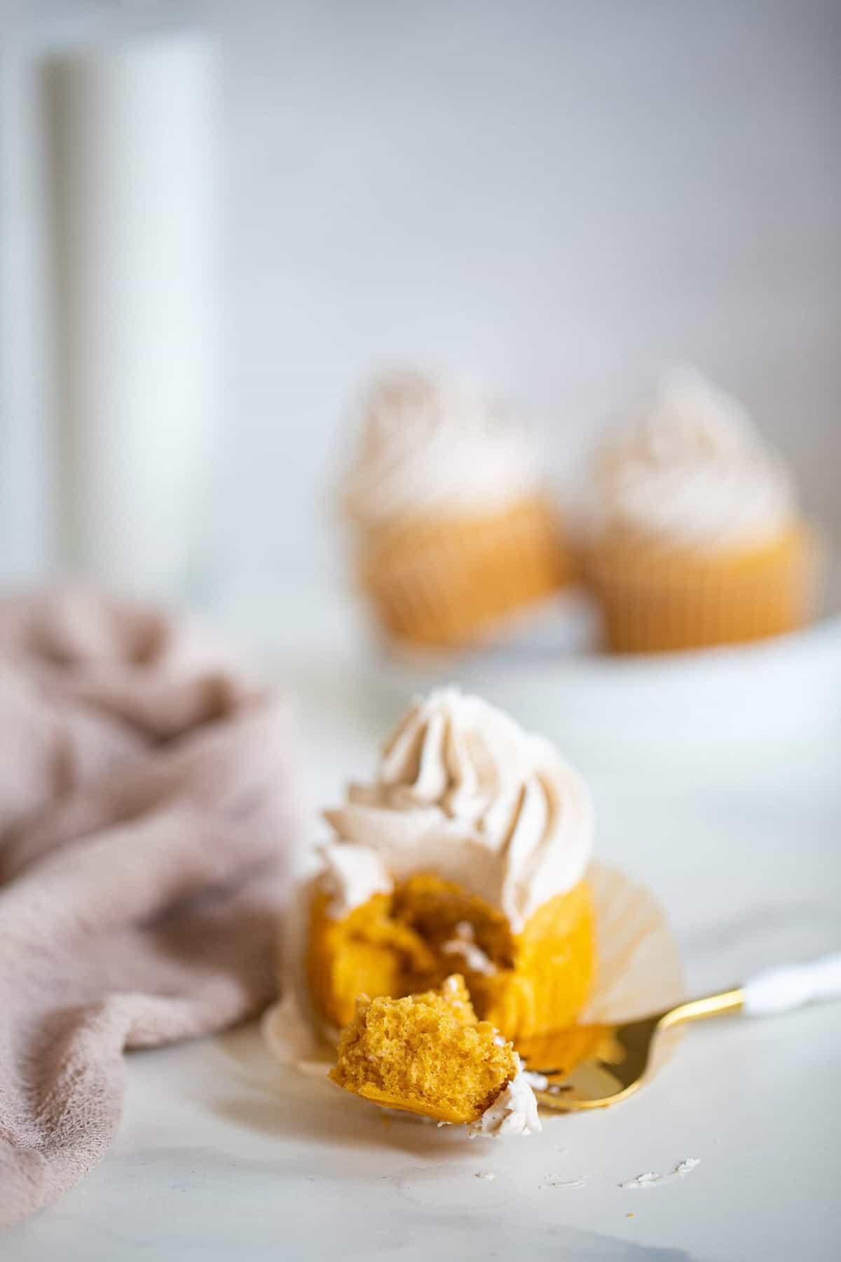 Fork grabbing a piece from a Pumpkin Chai Cupcake.