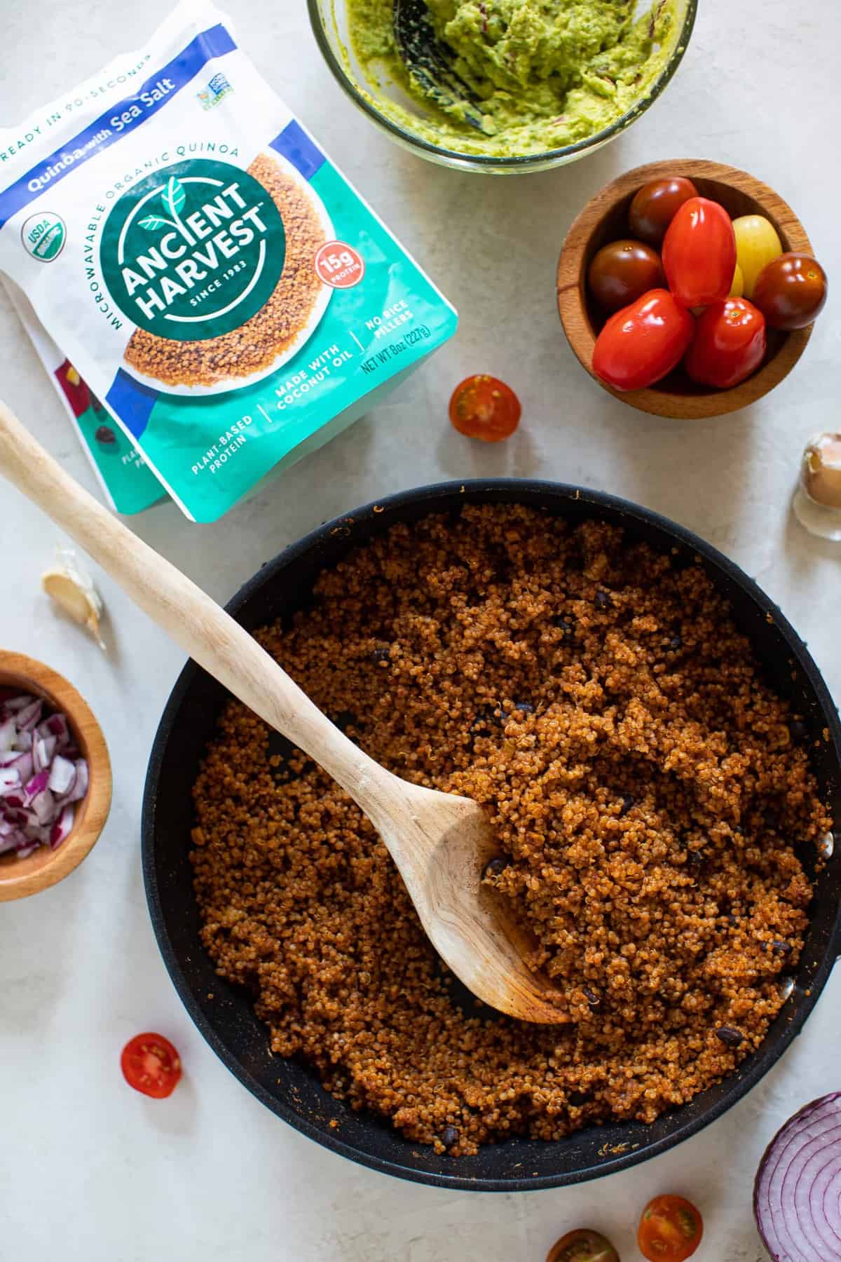 Black Bean and Quinoa nacho topping in a bowl with a spoon.