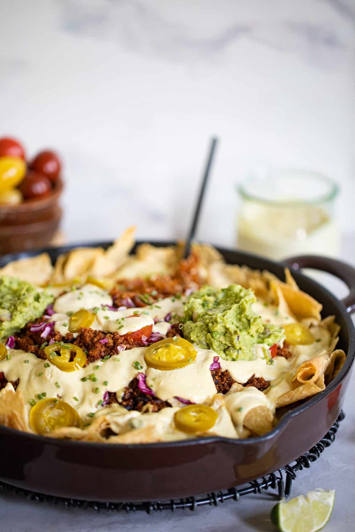 Fork in a skillet of Black Bean and Quinoa Nachos.