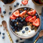 Greek Yogurt Breakfast Bowl topped with fruit and granola.