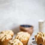 Maple Brown Butter Breakfast Muffins on and around a plate.