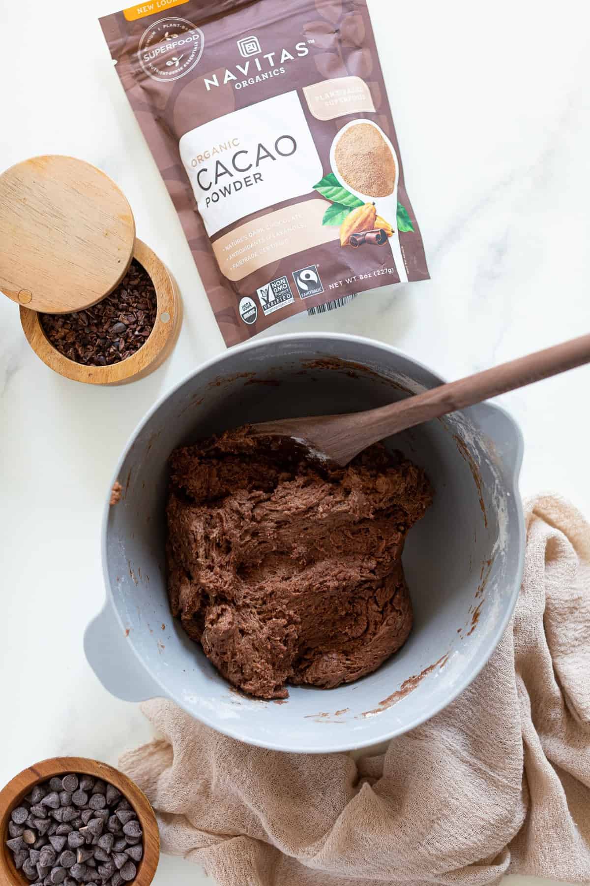 Vegan Chocolate Bread dough in a bowl with a spoon.