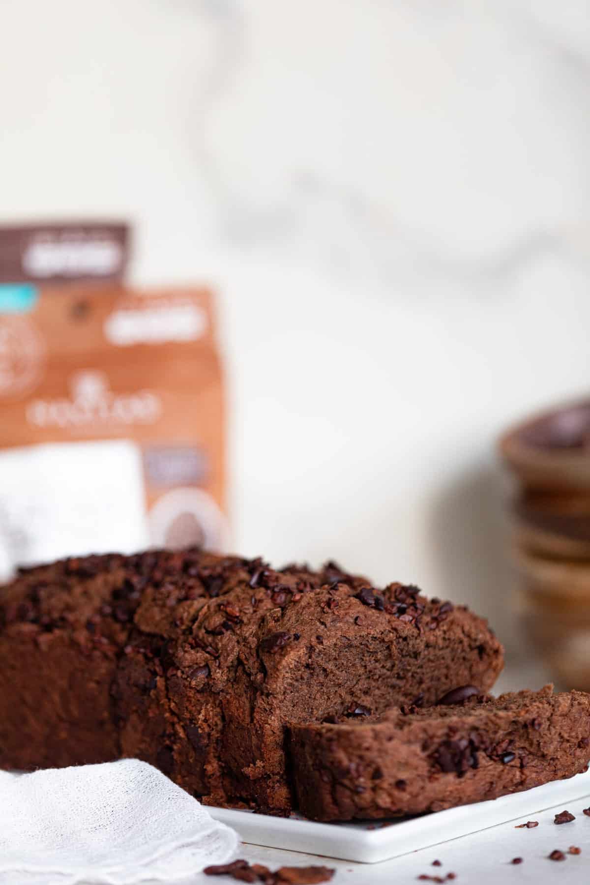 Partially-sliced loaf of Vegan Chocolate Bread.