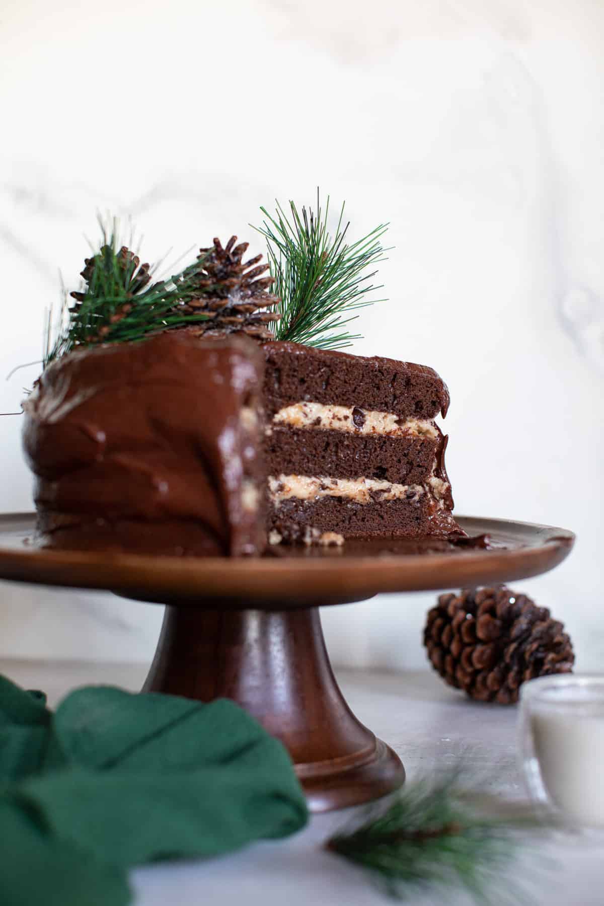 Vegan Brownie Cookie Dough Cake on a brown platter.