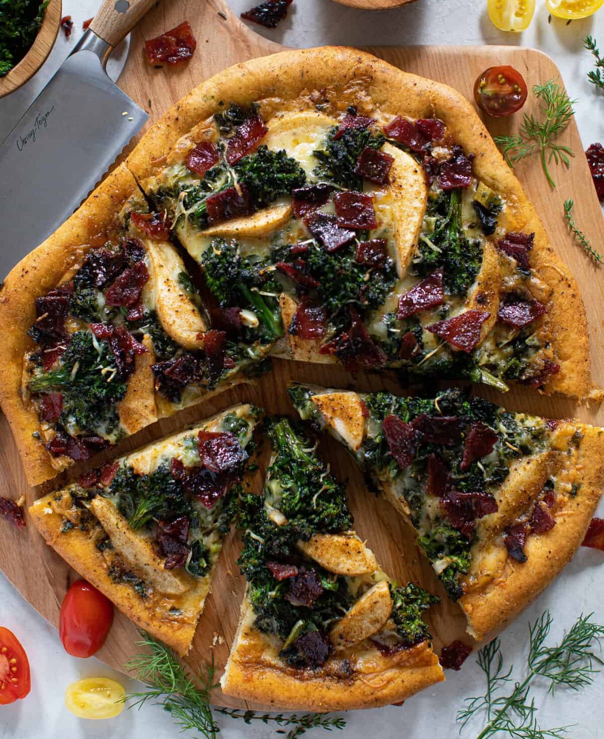 Partially-sliced Fall Harvest Pizza on a wooden board. One of the best fall recipes.