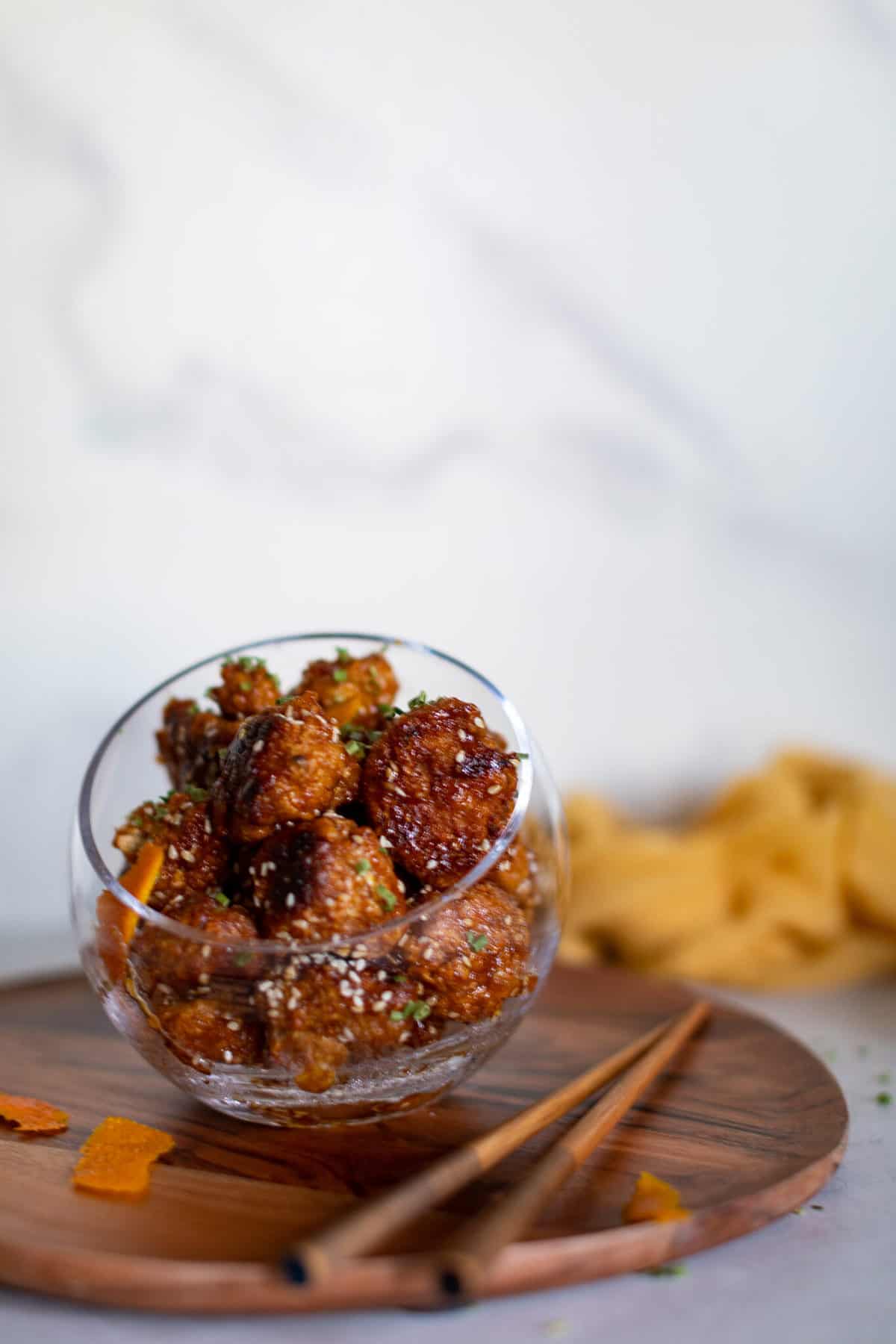 Crispy Baked Sticky Orange Cauliflower Bites in a glass bowl.