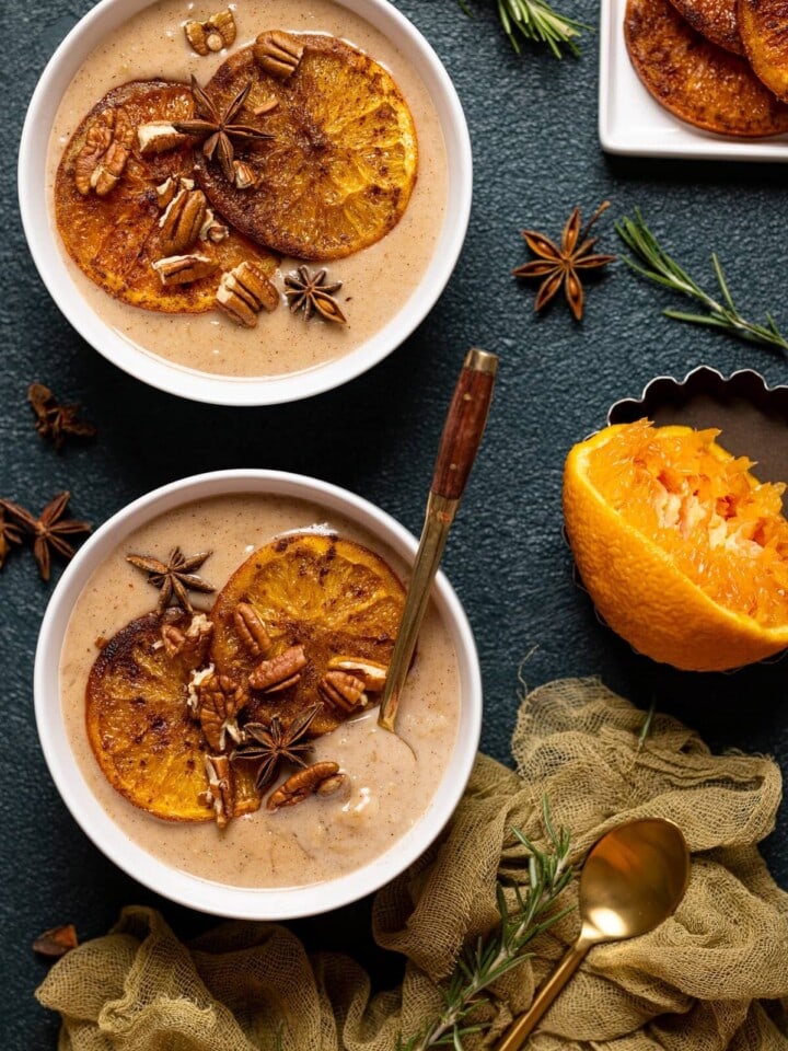 Overhead shot of two bowls of Maple Cinnamon Oatmeal with Roasted Oranges
