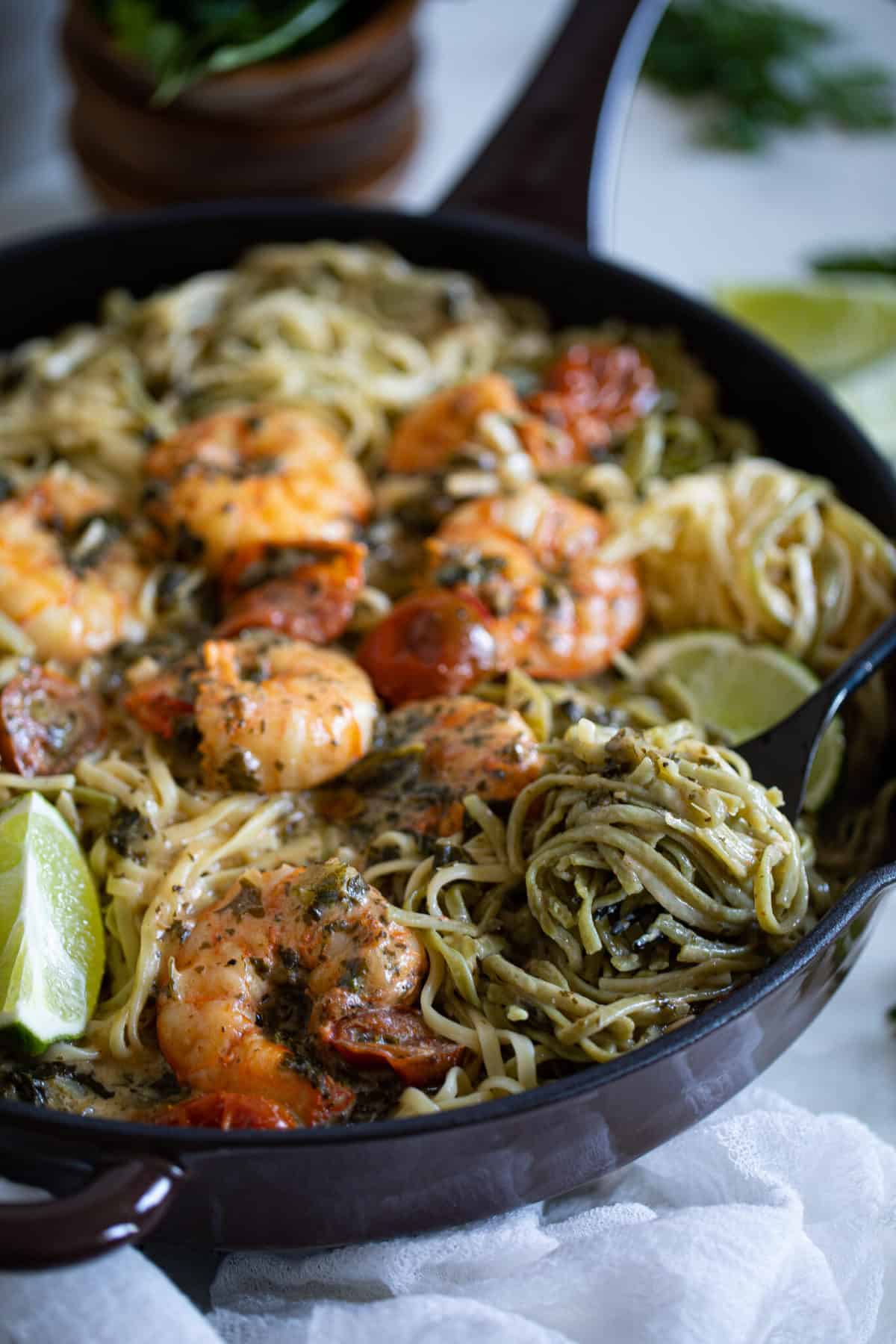 Fork grabbing some Gluten-Free Coconut Lime Shrimp Pasta.