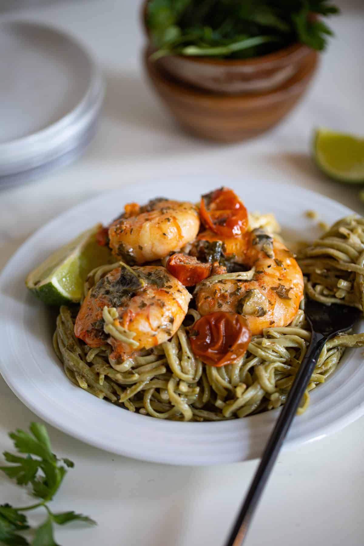 Fork on a plate of Gluten-Free Coconut Lime Shrimp Pasta.