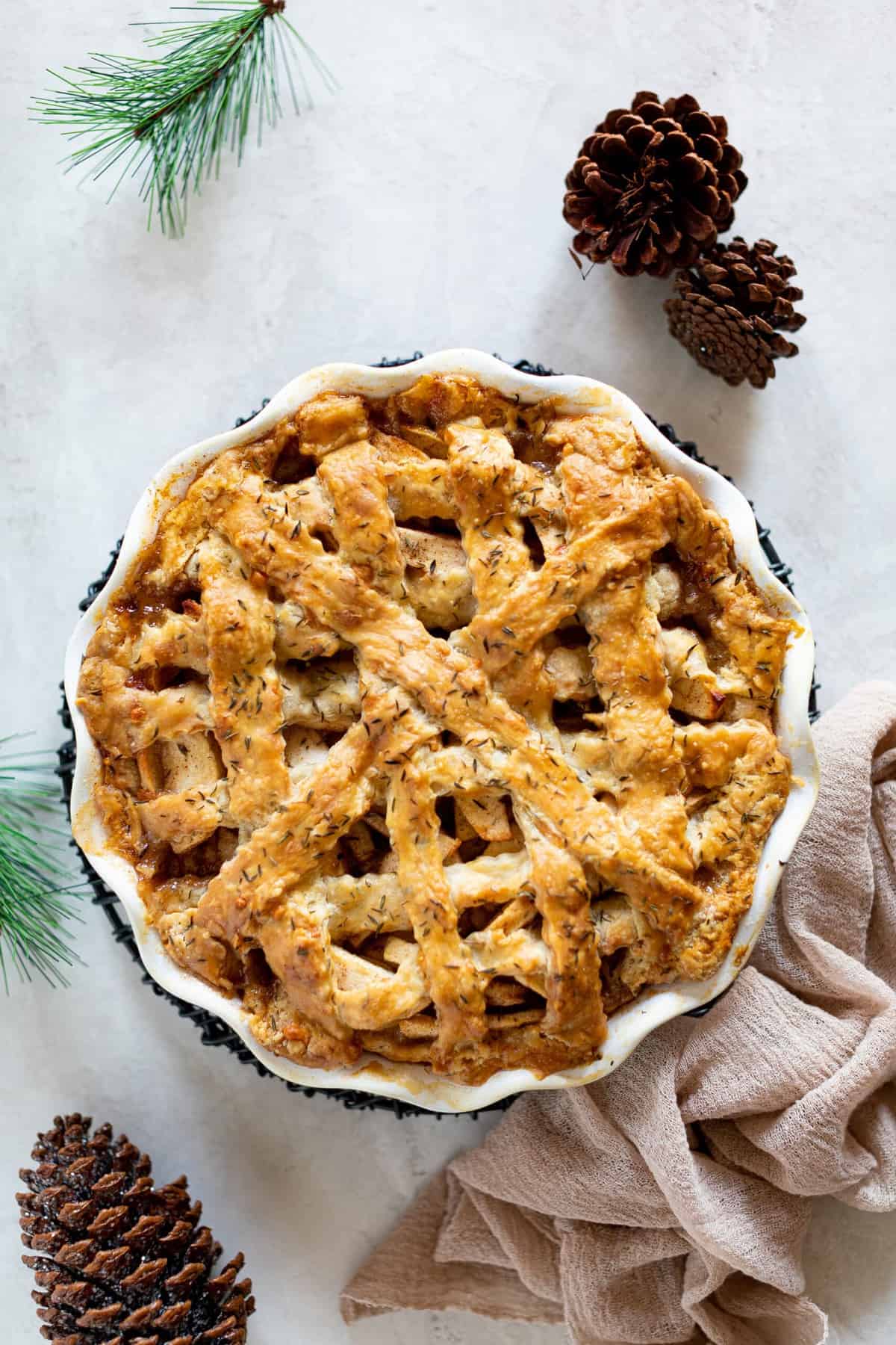 Apple Cheddar Thyme Pie with a latticed top.