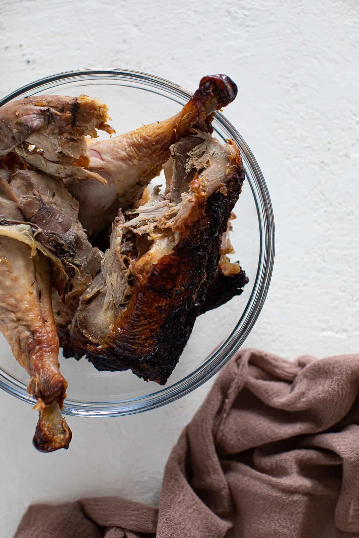 Bowl of cooked turkey still on the bone