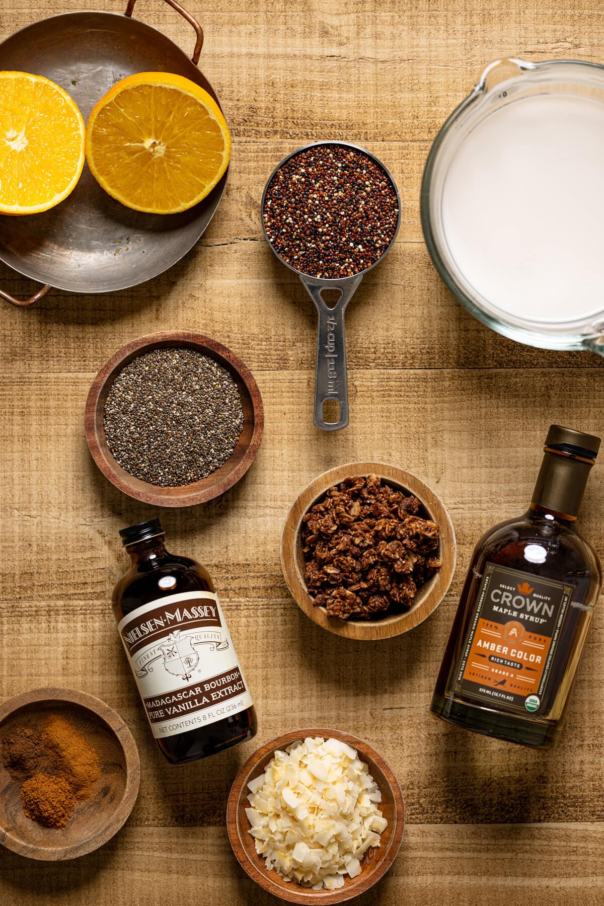 Ingredients for Winter Quinoa Breakfast Bowl including maple syrup, vanilla extract, and seasonings