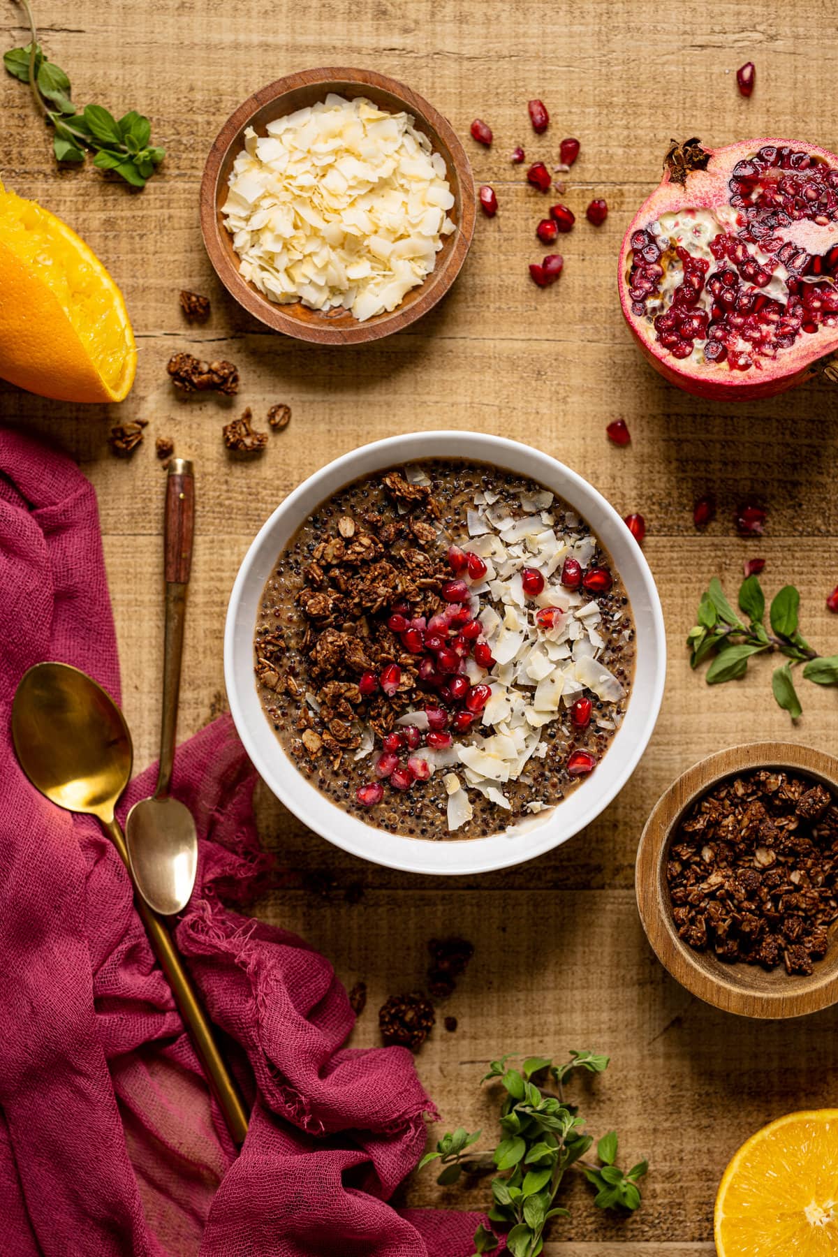 Winter Quinoa Breakfast Bowl topped with pomegranate seeds