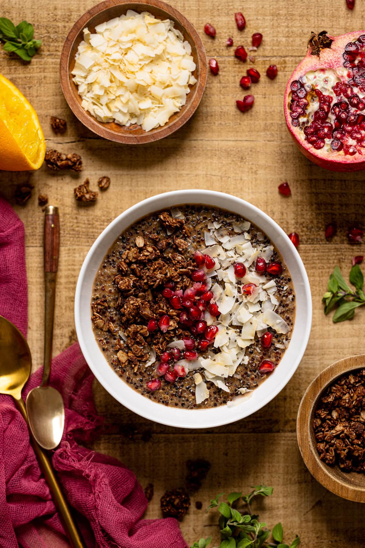 Winter Quinoa Breakfast Bowl topped with pomegranate seeds