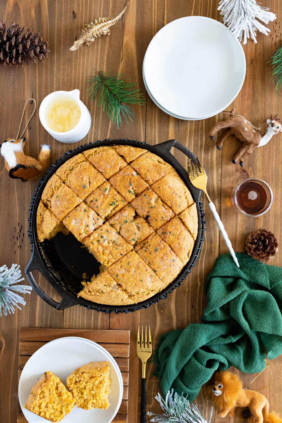 Skillet of Vegan Sweet Potato Maple Herb Cornbread missing some pieces.