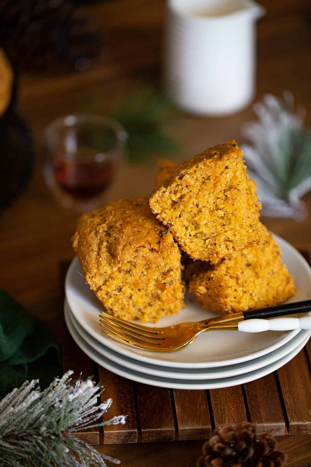 Pieces of Vegan Sweet Potato Maple Herb Cornbread on small plates.