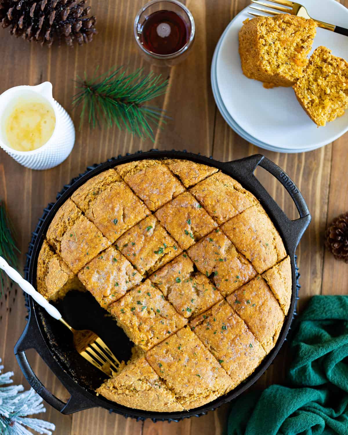 Vegan Sweet Potato Maple Herb Cornbread on a plate and in a skillet.