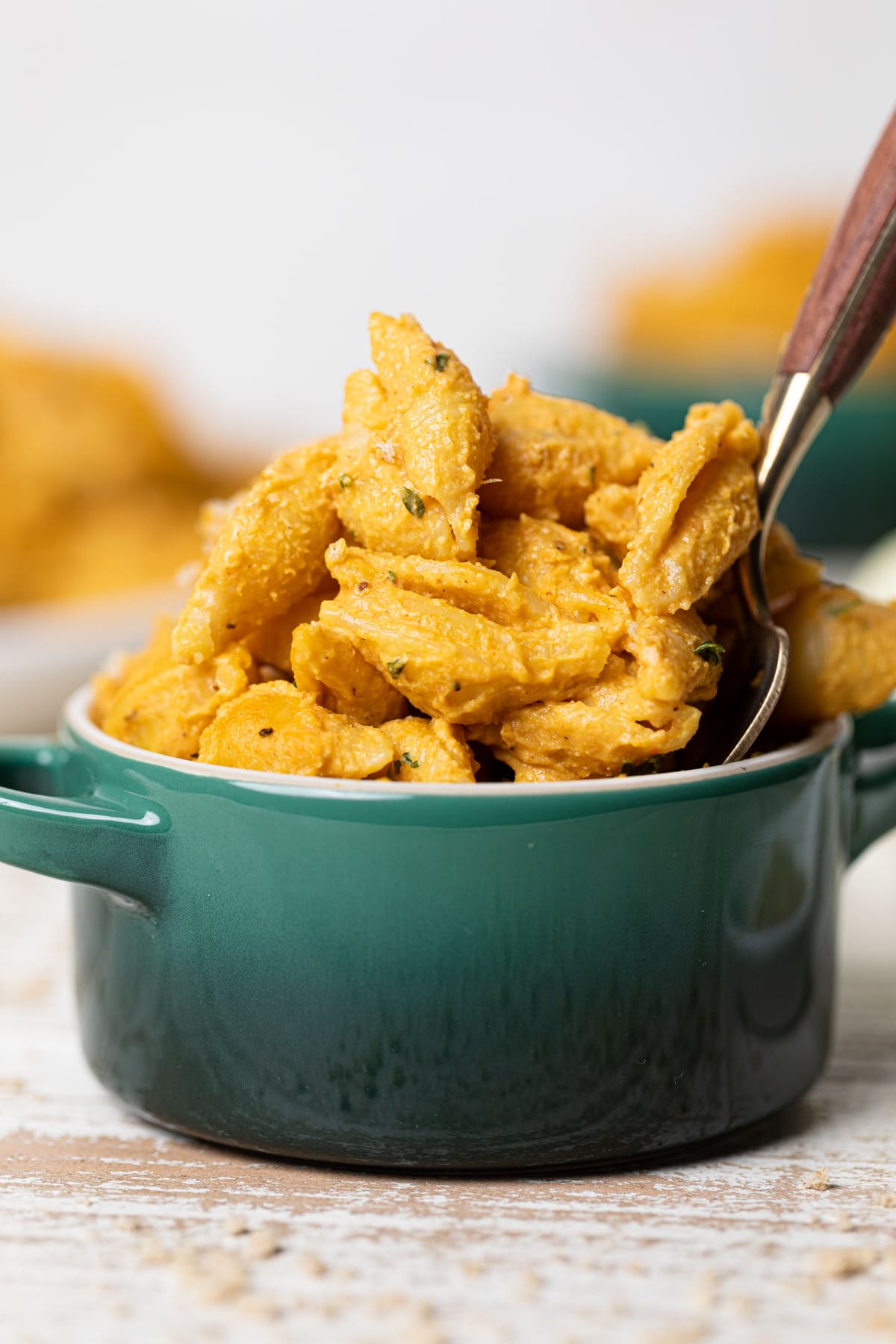 Closeup of a small bowl of Vegan Pumpkin Mac and Cheese