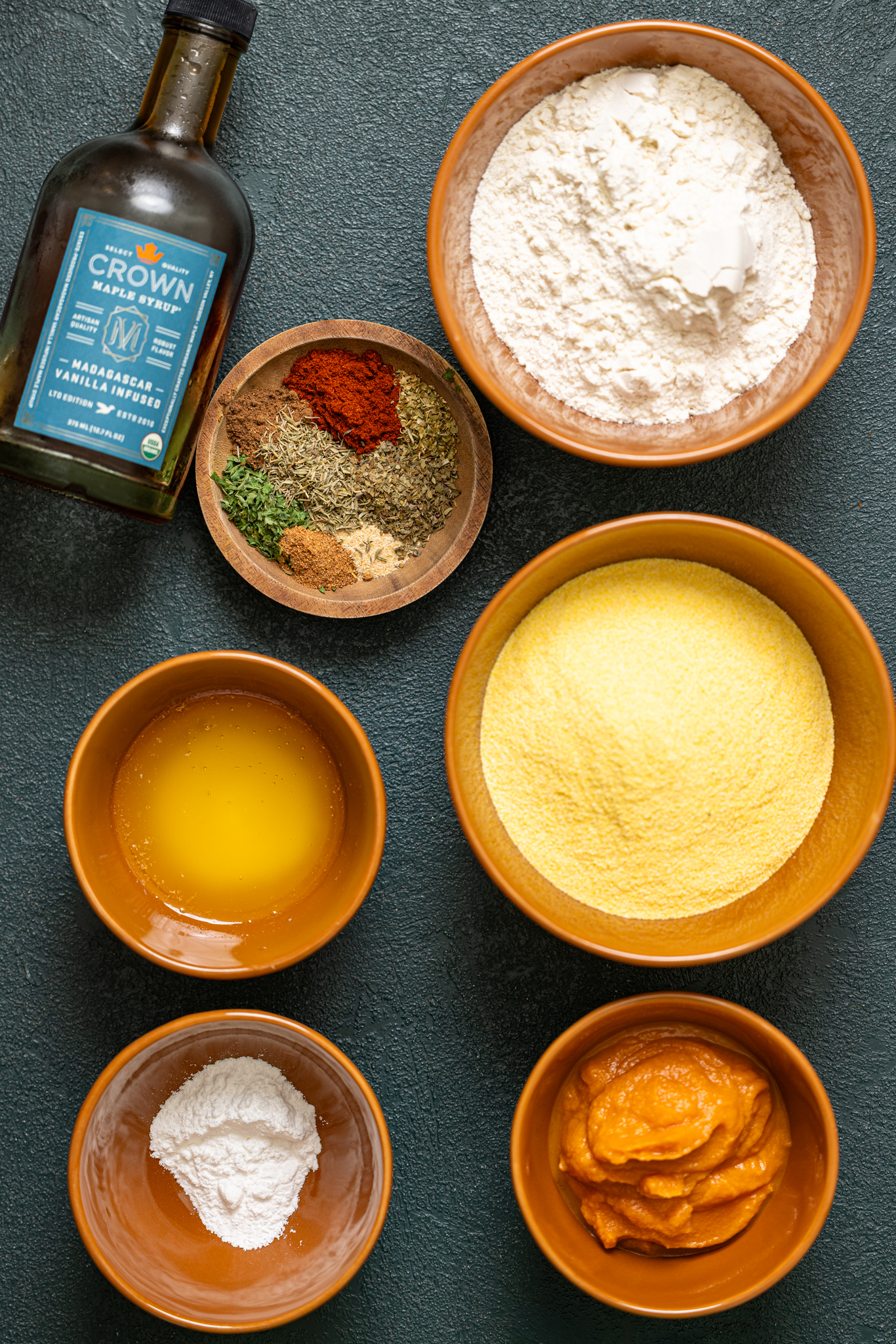 Ingredients on a hunter green table.
