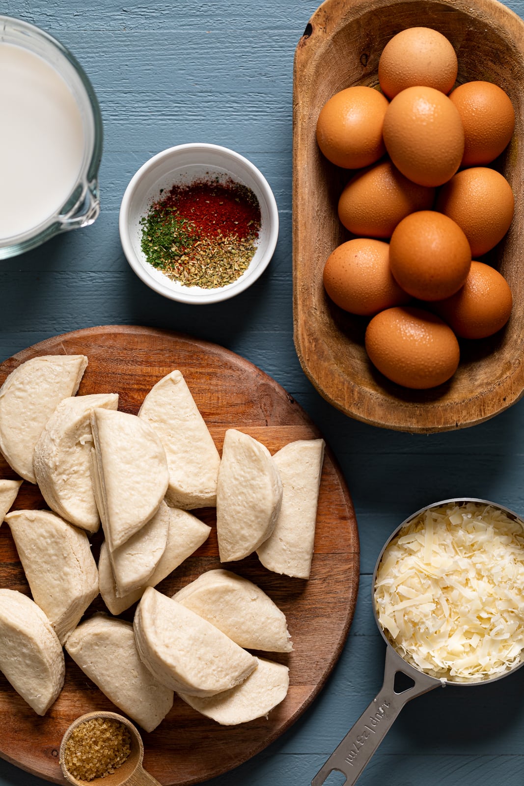 Ingredients for Southern Caprese Biscuit Breakfast Strata including eggs, organic biscuit dough, and organic mozzarella cheese