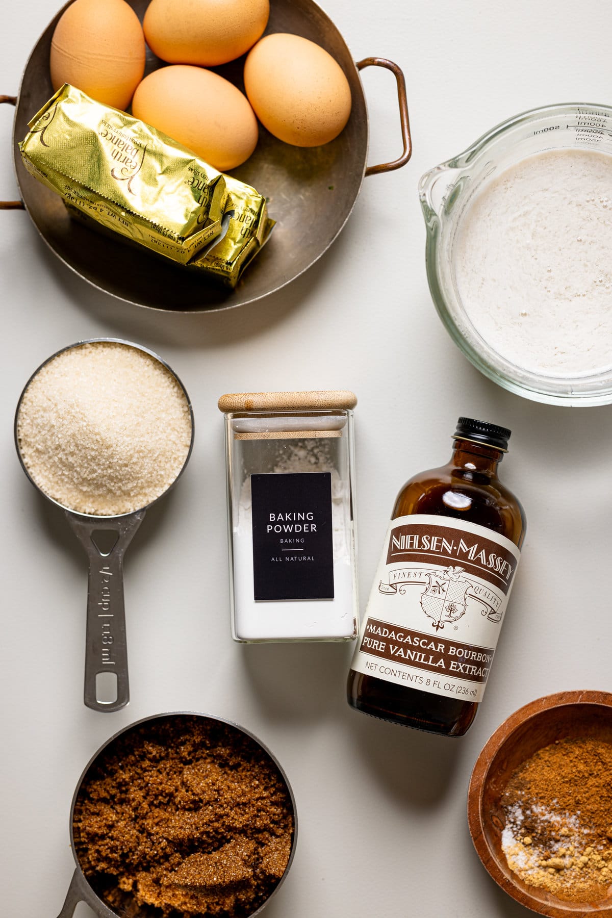 Ingredients for Carrot Cake with Chai Buttercream including baking powder, vanilla extract, and eggs