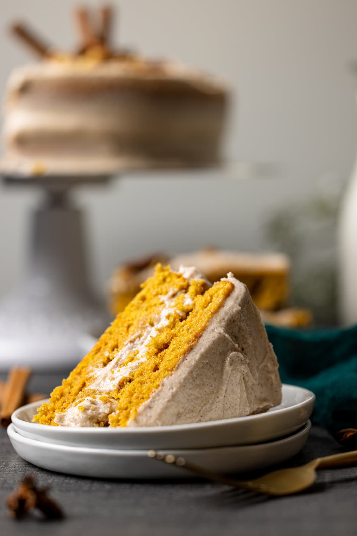 Slice of Carrot Cake with Chai Buttercream lying on its side