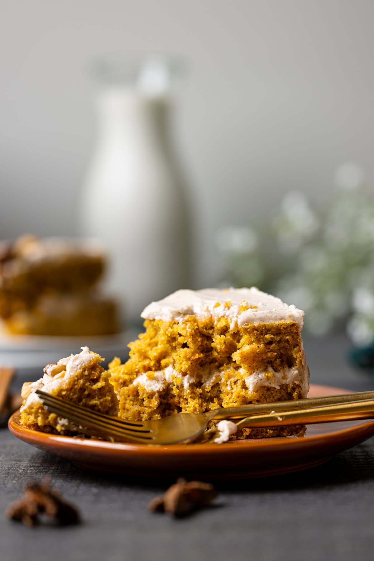 Partially-eaten slice of Carrot Cake with Chai Buttercream