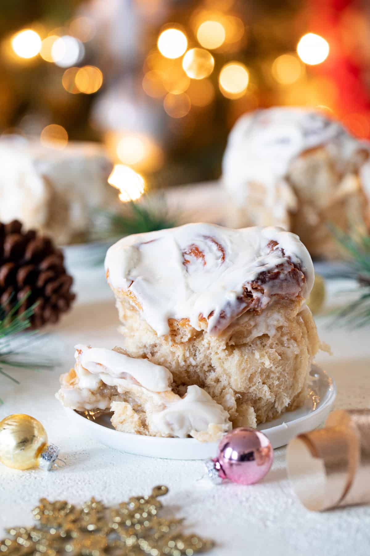 Fluffy Apple Butter Eggnog Cinnamon Roll on a small plate.