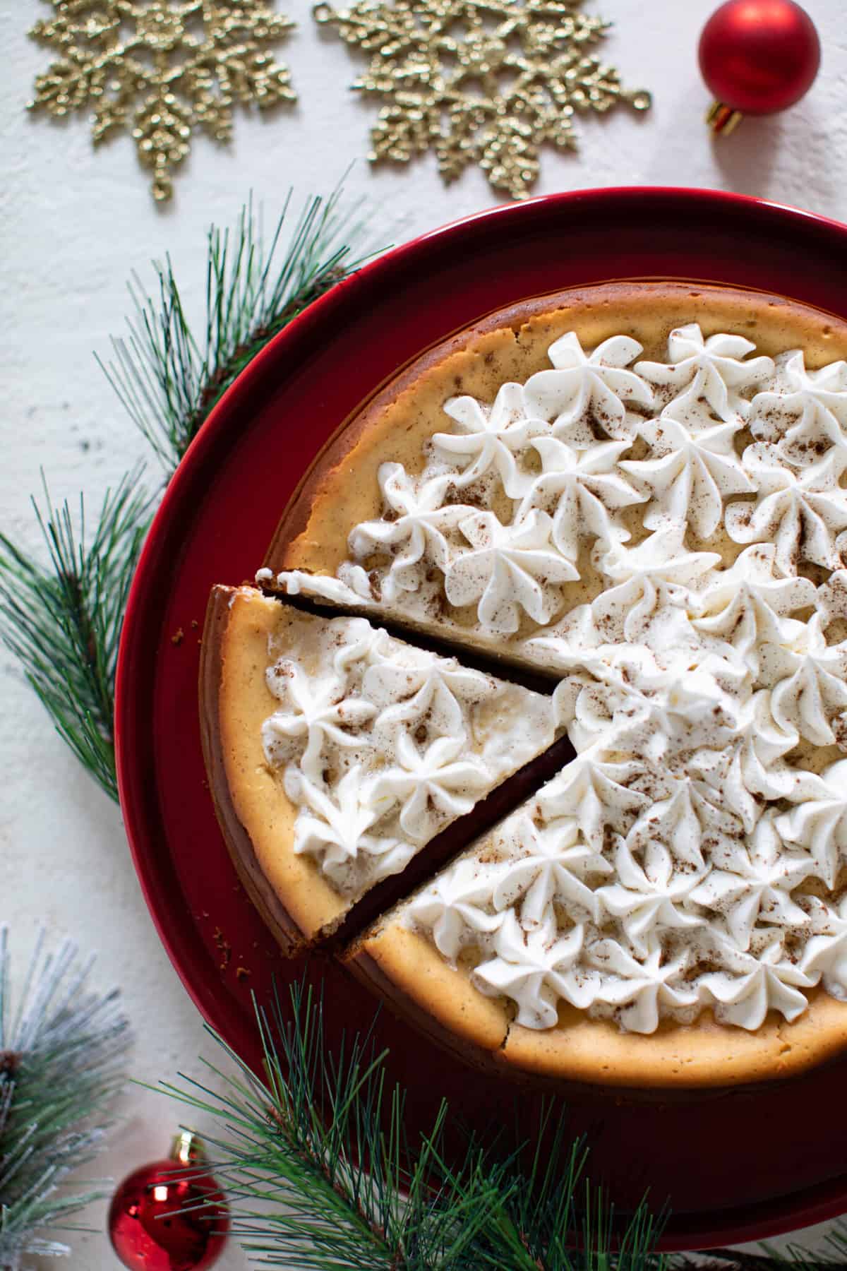 Spiced Chai Cheesecake with Gingersnap Crust with one piece cut.