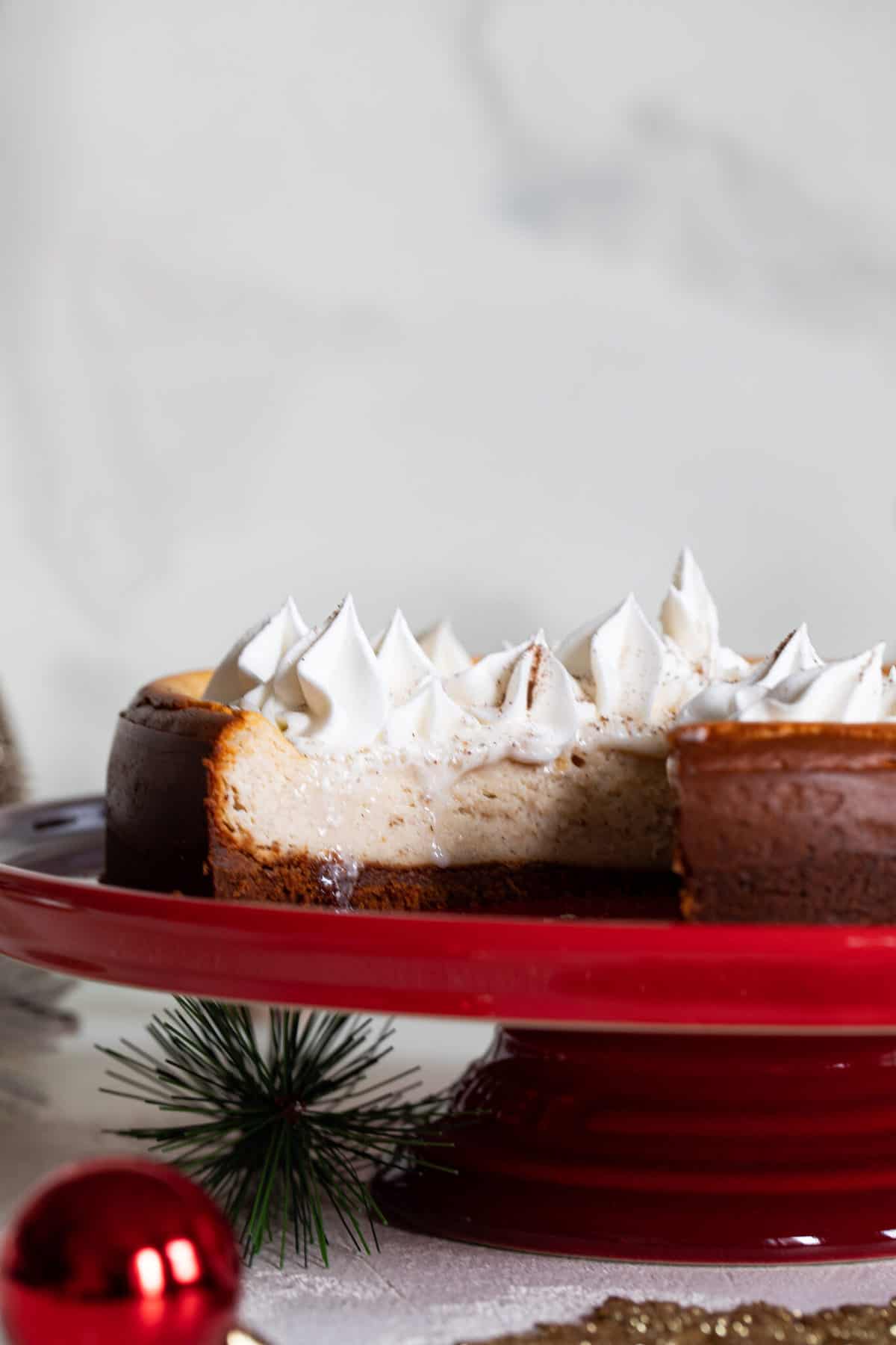 Slice pulled out from a Spiced Chai Cheesecake with Gingersnap Crust.