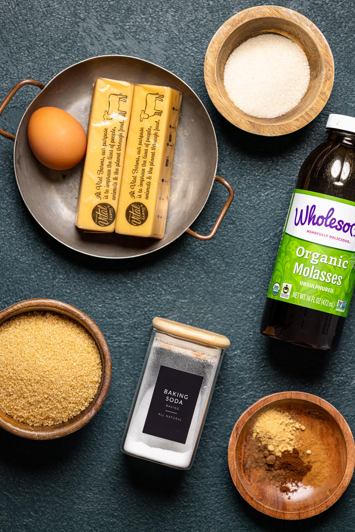 Ingredients for Gingerbread Oatmeal Cookies including eggs, baking soda, and molasses