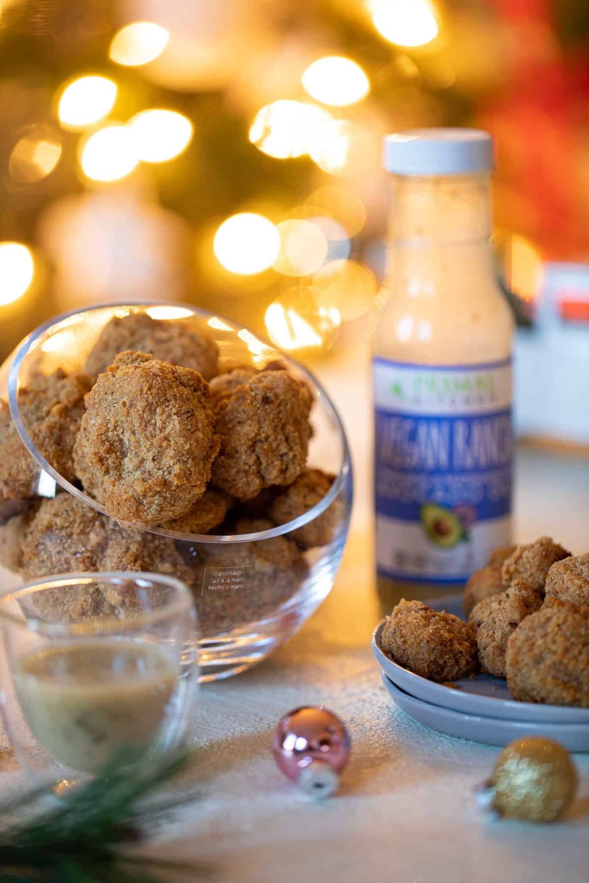 Crispy Vegan Ranch Popcorn Cauliflower Bites in a small, glass bowl and on a plate.