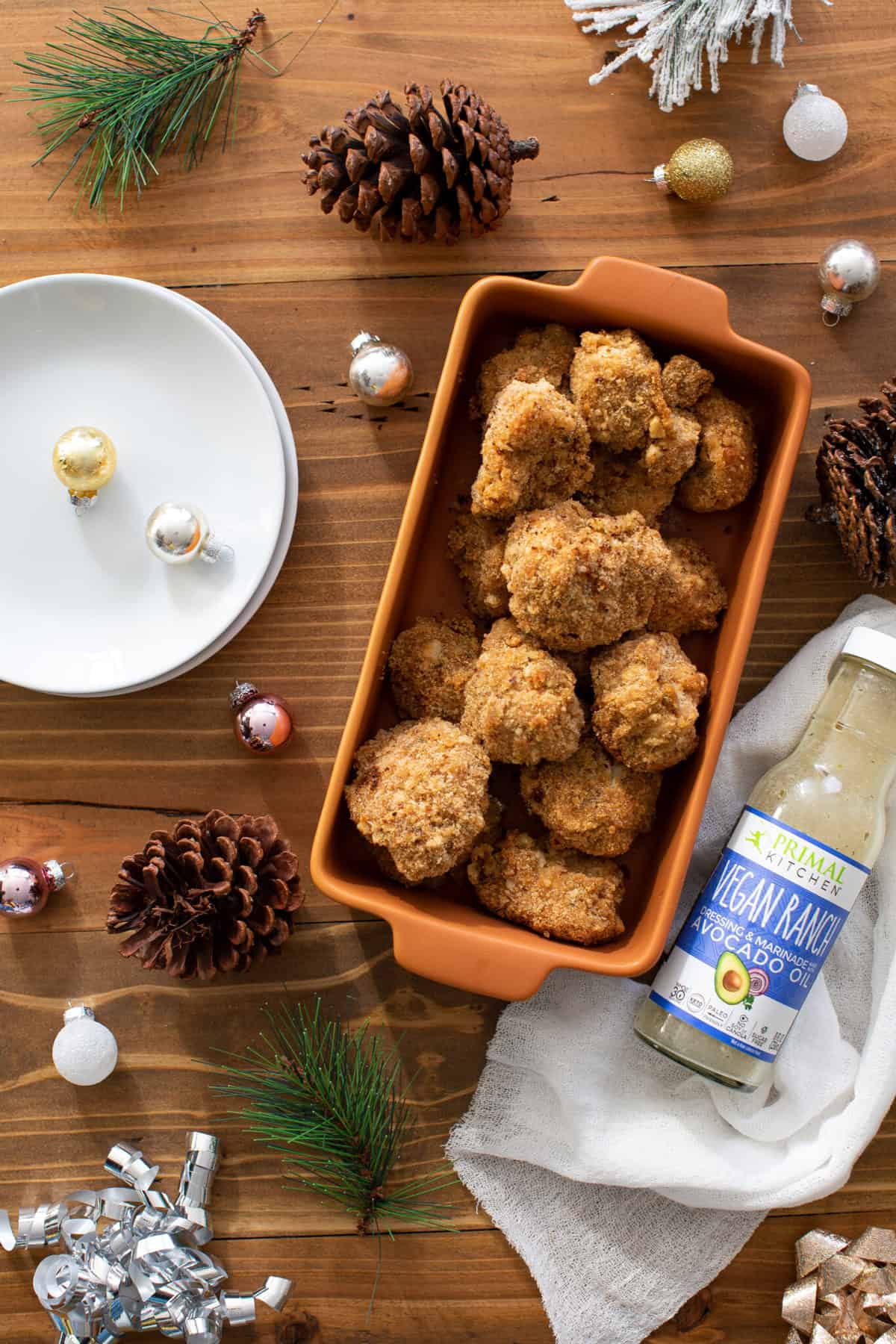 Orange dish full of Crispy Vegan Ranch Popcorn Cauliflower Bites.