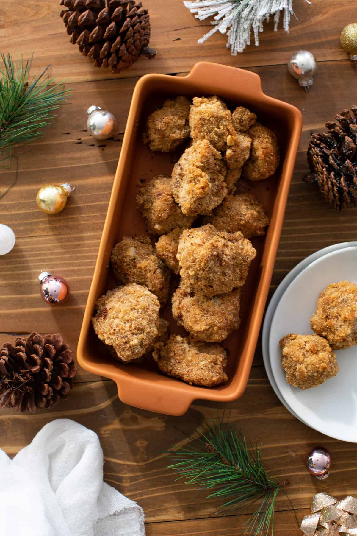 Crispy Vegan Ranch Popcorn Cauliflower Bites in an orange dish and on a plate.