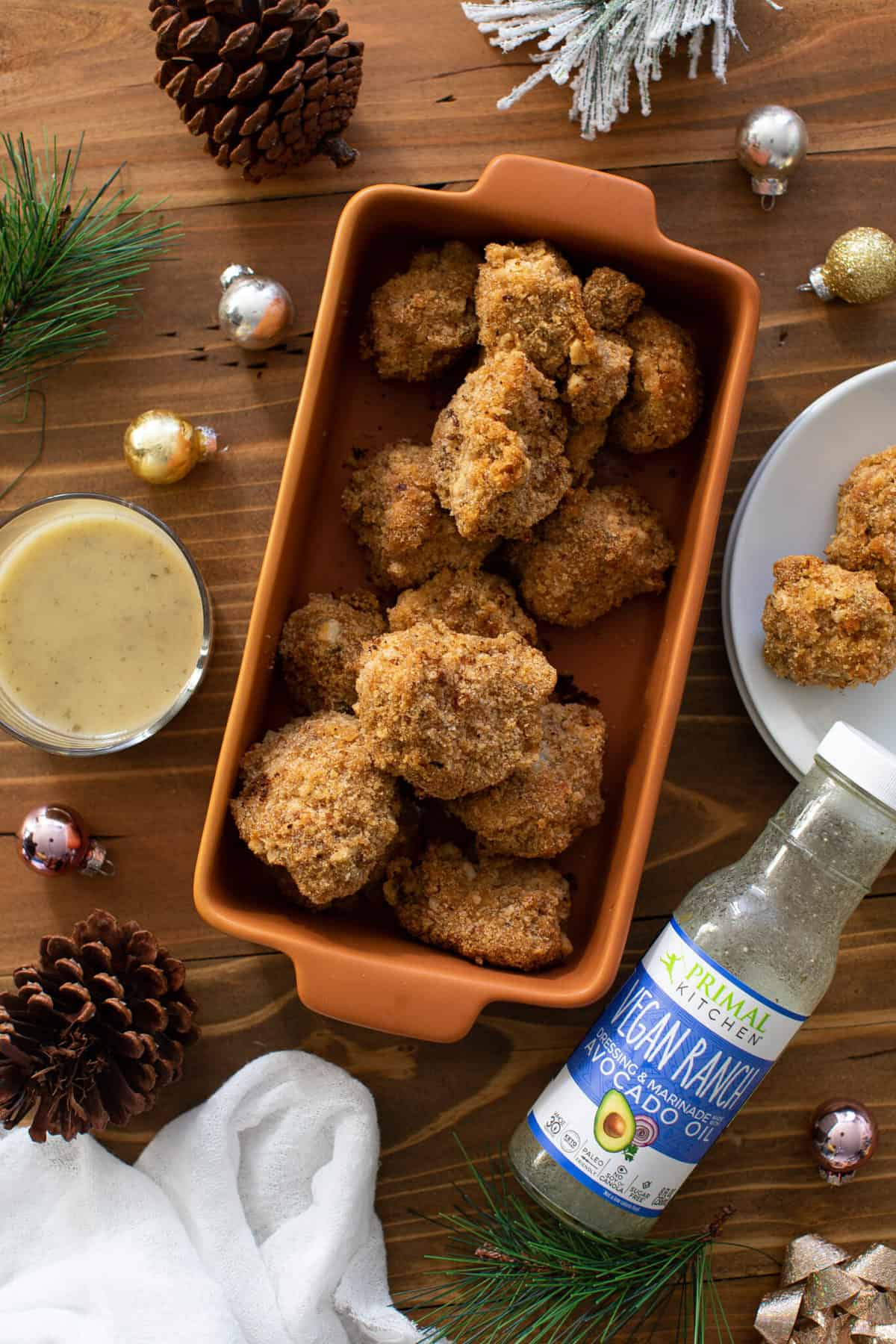 Crispy Vegan Ranch Popcorn Cauliflower Bites in an orange dish.