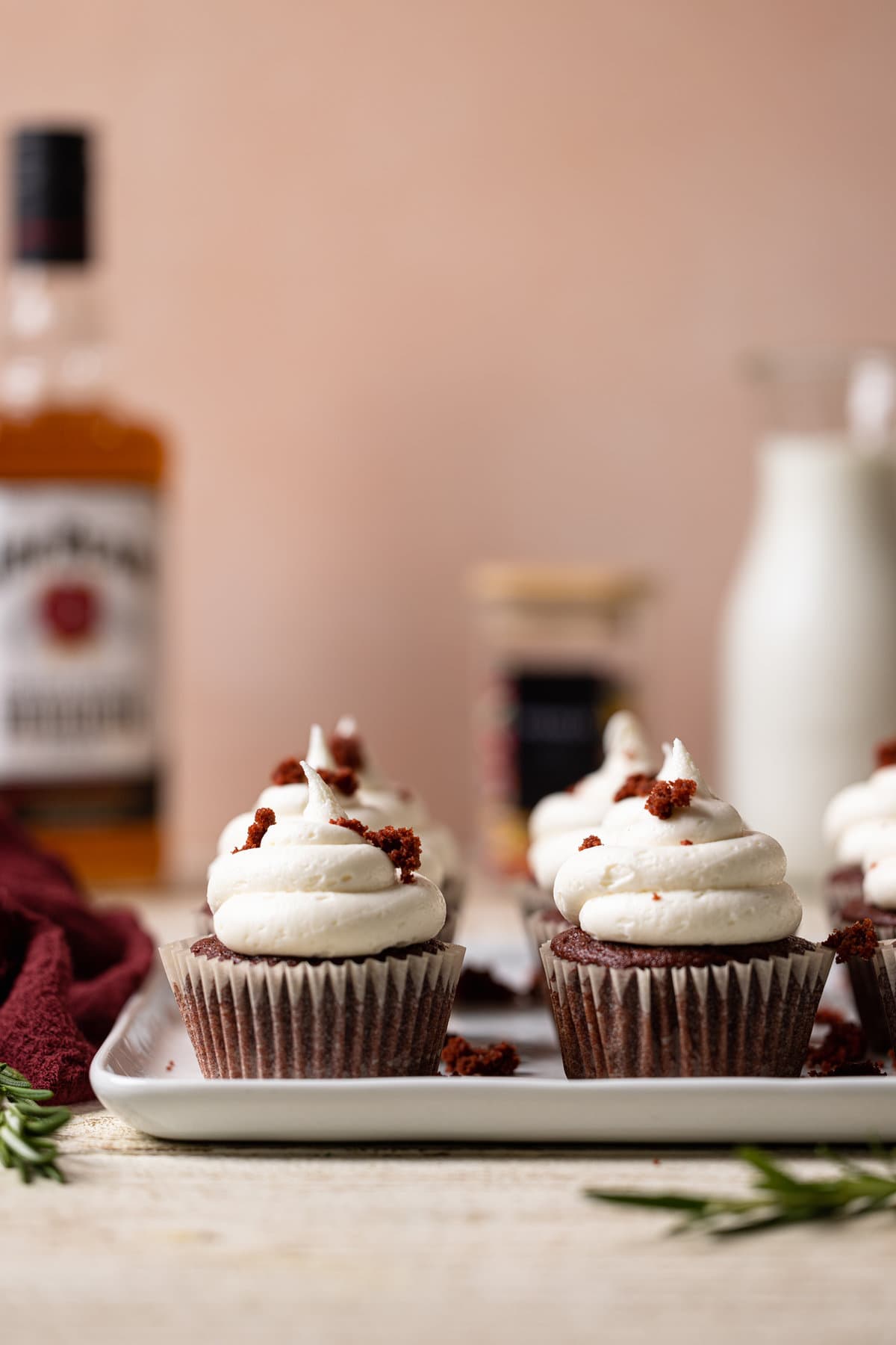 Vegan Red Velvet Cupcakes with Bourbon Vanilla Buttercream on a white dish.