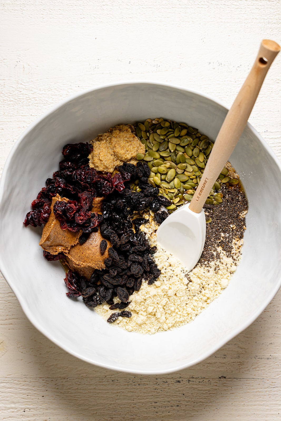 Ingredients together in a white bowl with a spatula. 