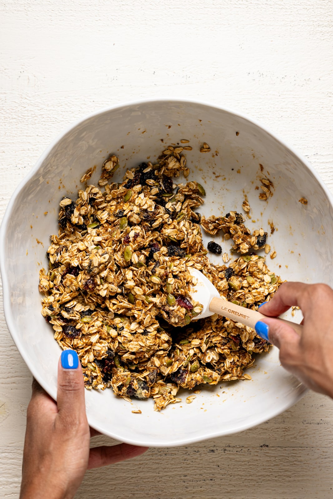 Ingredients mixed together in a white bowl with a spatula. 