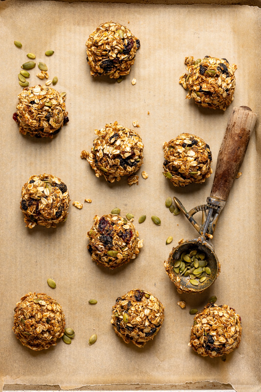 Cookies scooped on a baking sheet with parchment paper. 