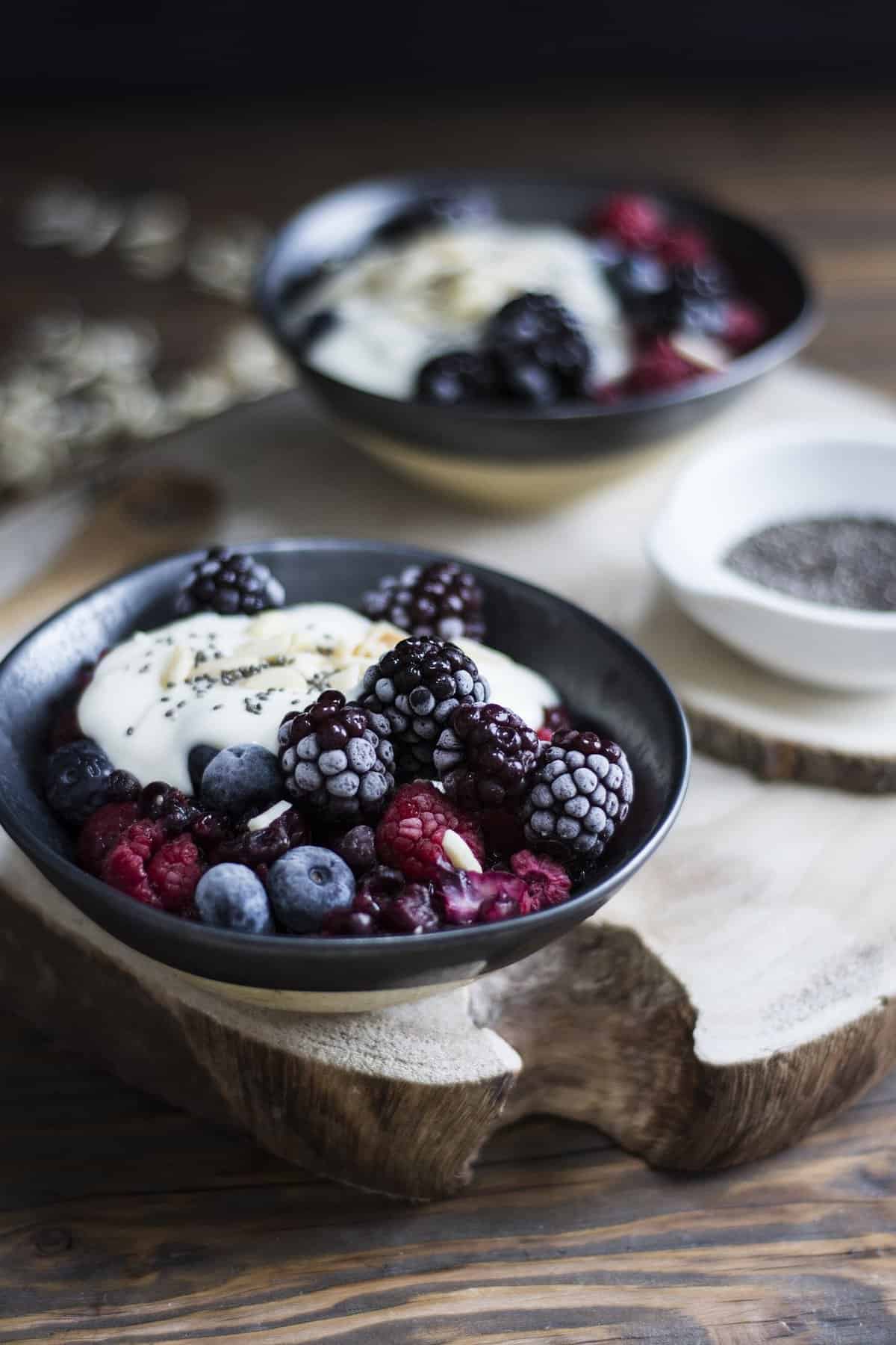 Bowl of frozen fruit and dairy-free ice cream.