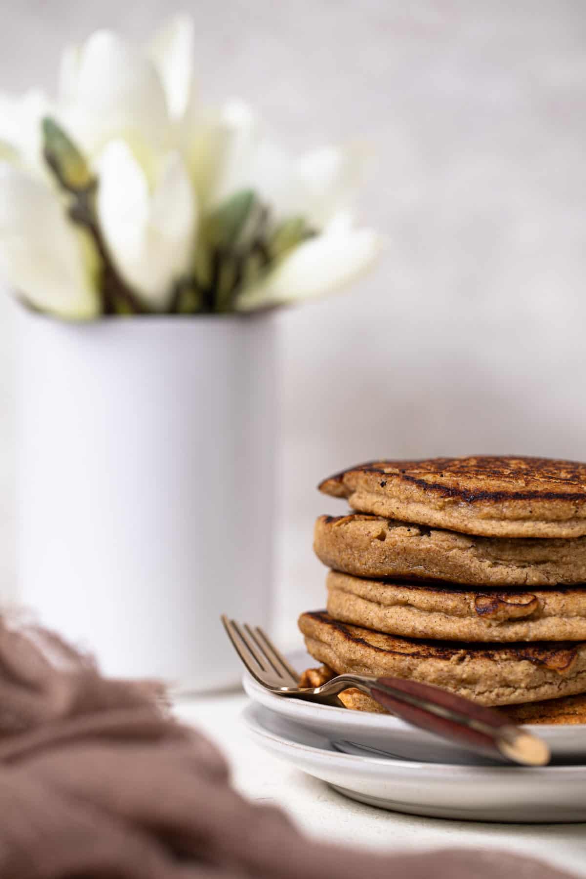 Flourless Apple Pancakes on a plate with a fork.