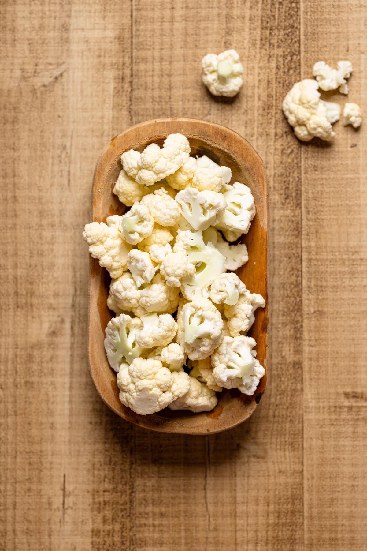 Wooden bowl of chopped cauliflower