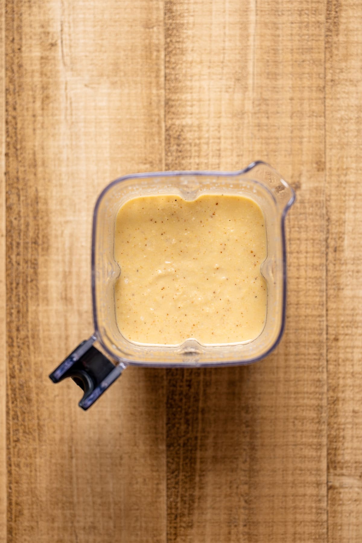 Blender full of Creamy Roasted Garlic Cauliflower Chickpea Soup base