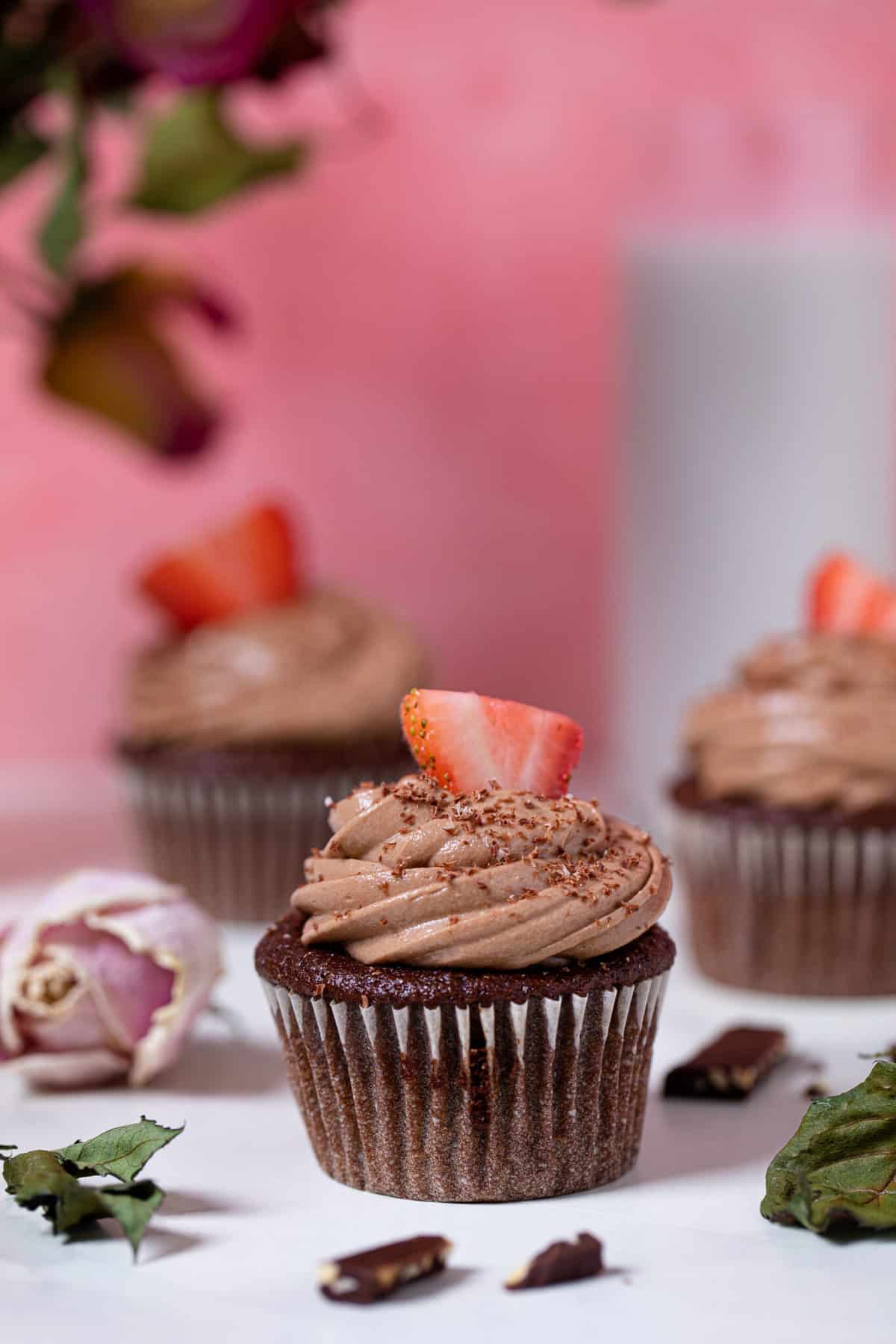 Bailey’s Chocolate Cupcakes topped with halved strawberries.