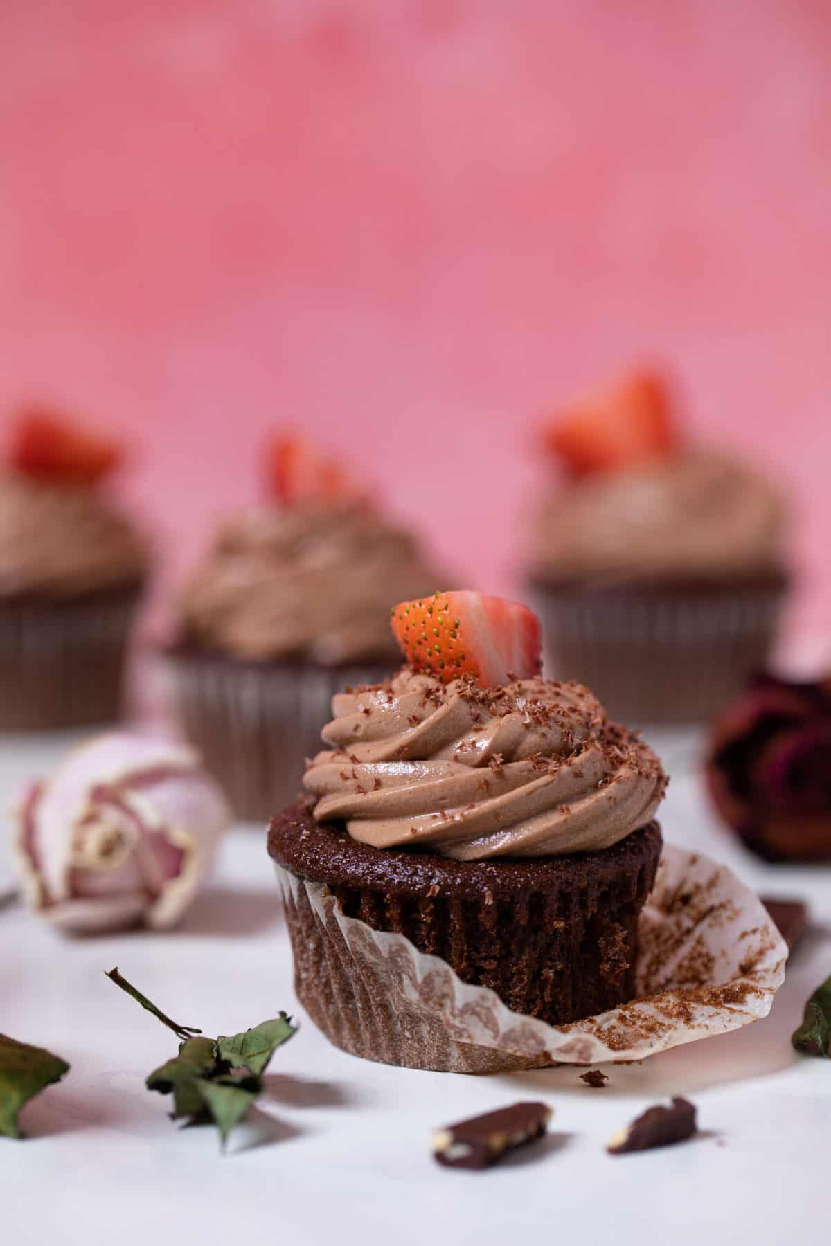 Break Up Bailey’s Chocolate Cupcake with the cupcake wrapper partially removed.