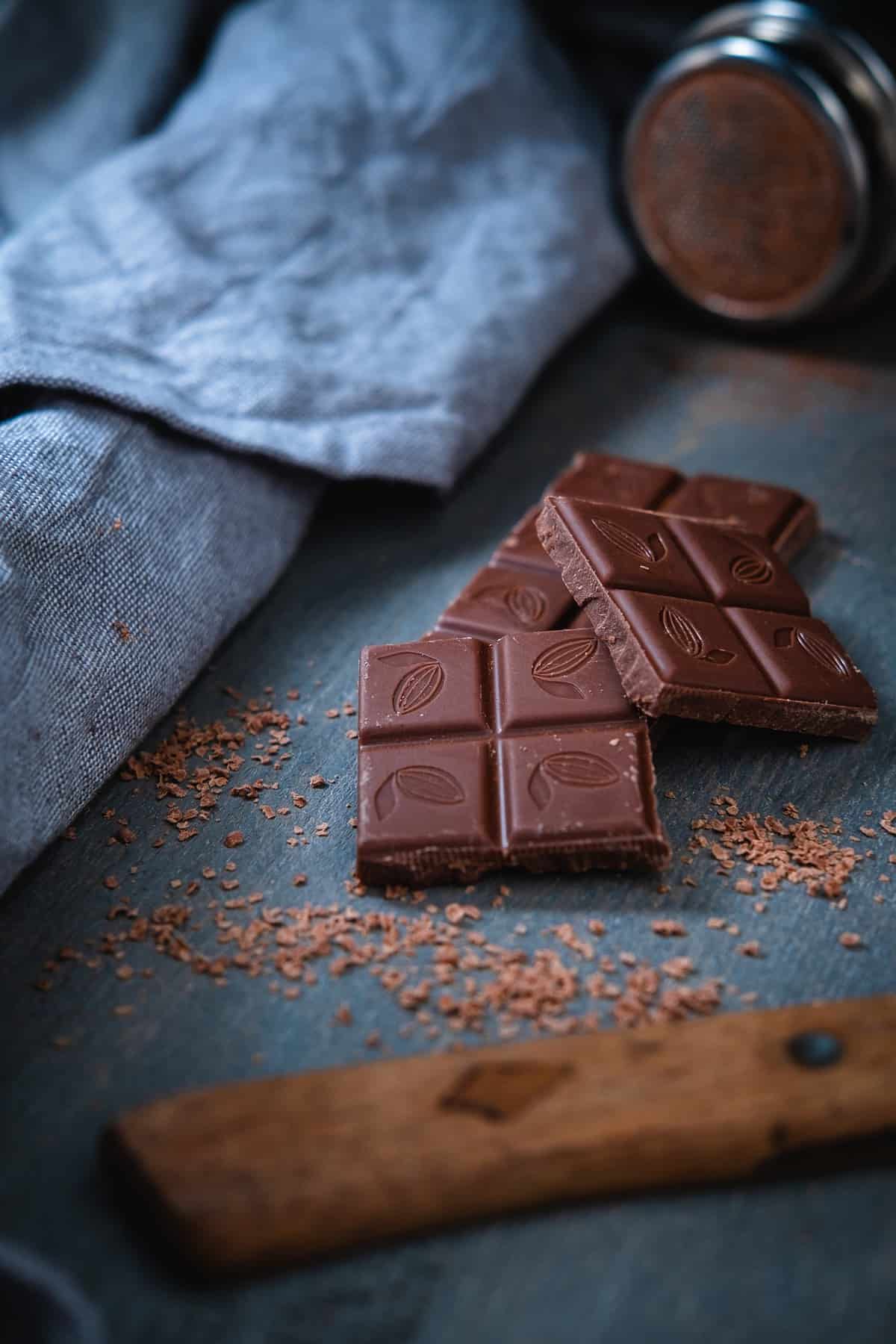 Chocolate squares on a blue table.