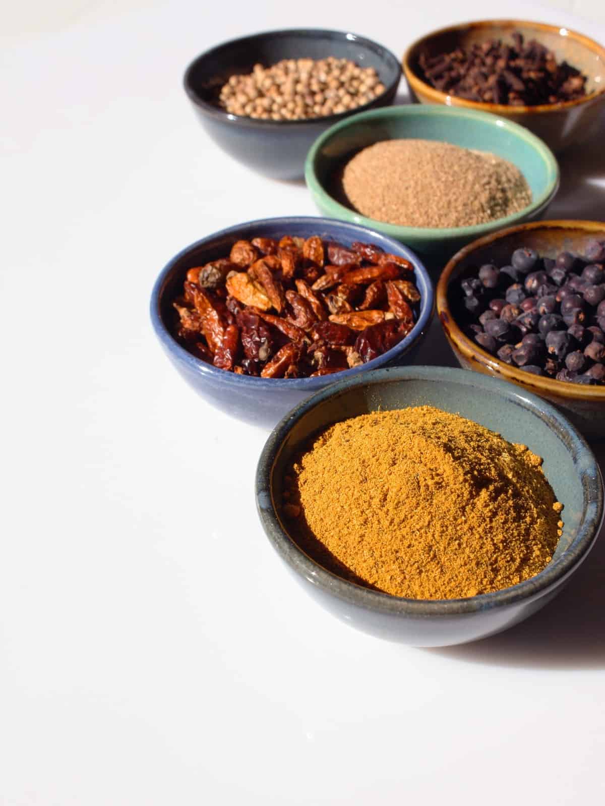 Small bowls of spices and flavorings.