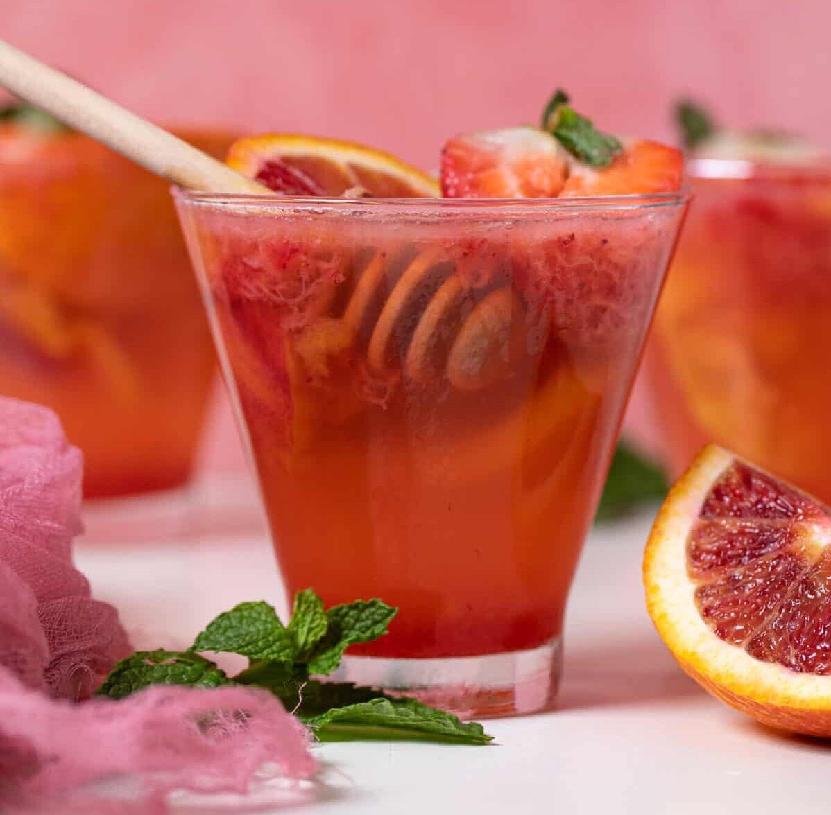 Small glass of Blood Orange Strawberry Ginger Mocktail.