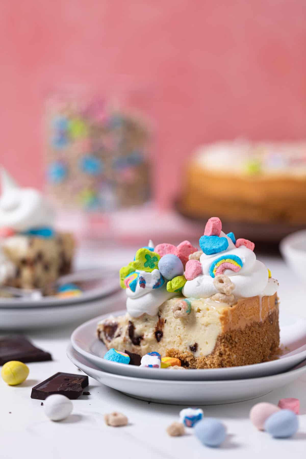 Chocolate Chip Lucky Charms Cheesecake heaping with Lucky Charms marshmallows.
